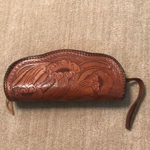 Handtooled leather clutch